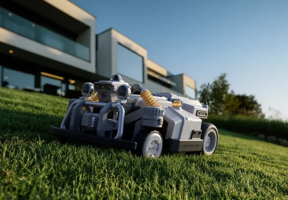 Commercial robotic mower beside a building
